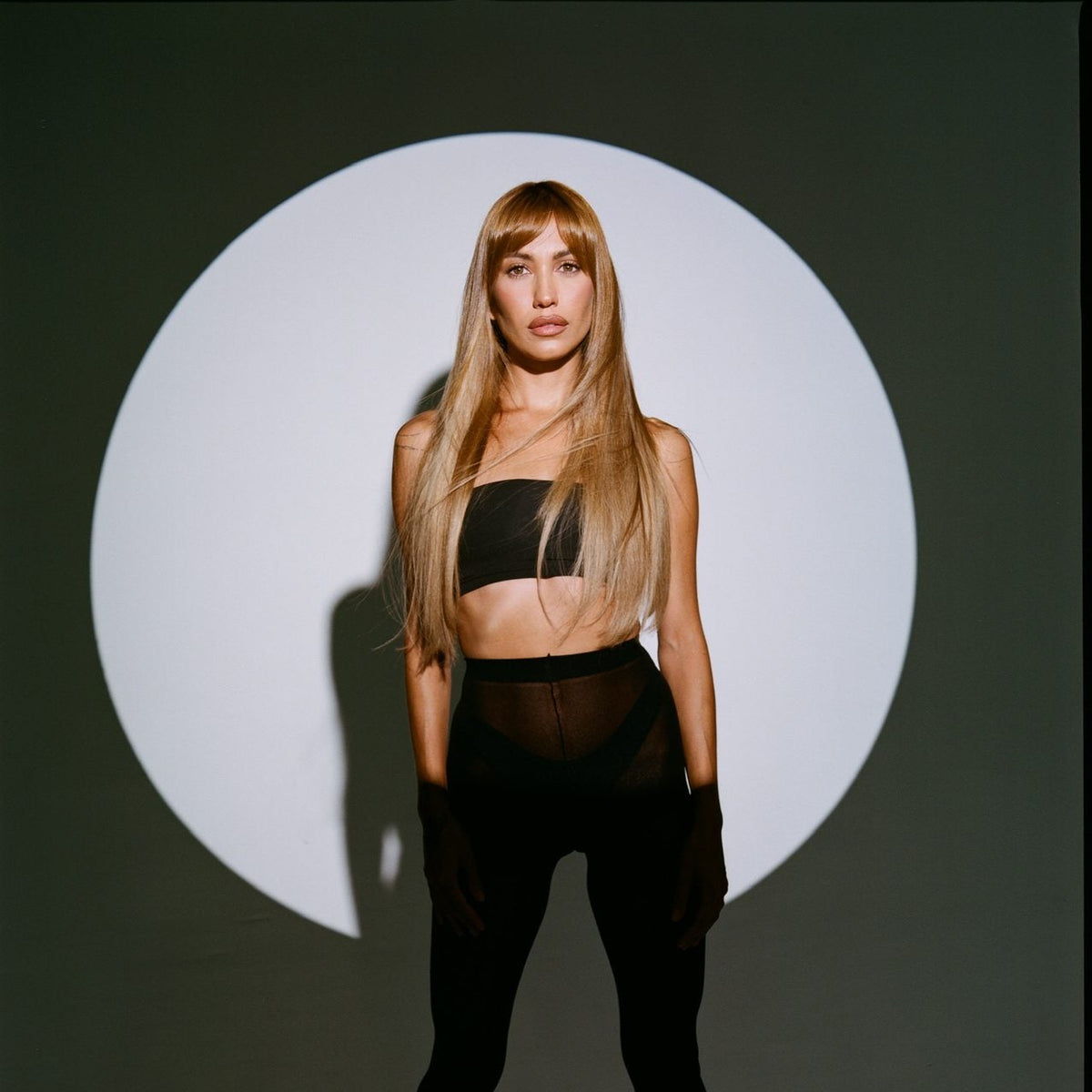 Model wearing golden blonde SHAE Hair extensions with bangs